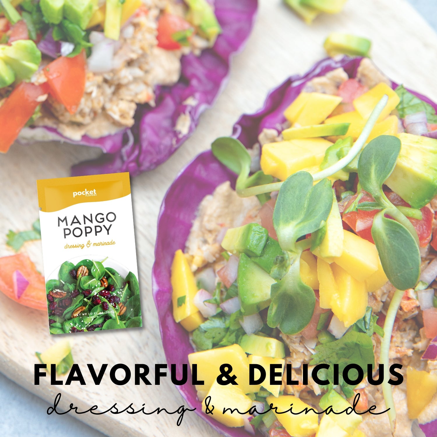 Single serve mango poppy salad dressing packet next to mango and cabbage dish.